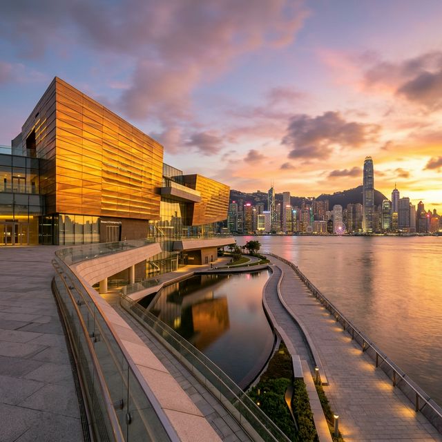 Modern museum architecture at waterfront during golden hour sunset